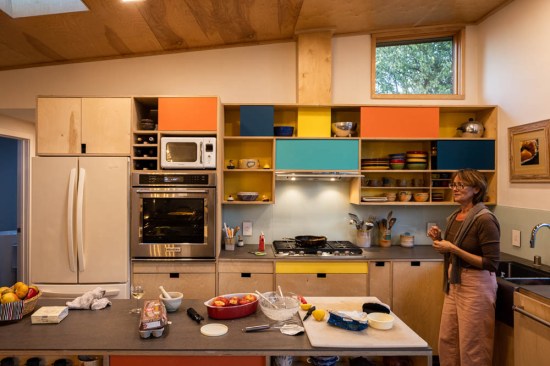 This mid-century modern inspired kitchen is highlighted by Sarah Burgevin's ceramic work
