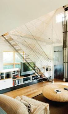 Counterbalanced Steel Stair - Bozeman, Montana This small footprint infill house called for a high economy of flexible space, inspiring a counterbalanced stair, which could be manually pulled down or pushed up as required with a minimum of physical effort.
Architect: Intrinsik Architecture