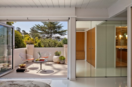 A Nanawall door opens onto the deck off the master bedroom.