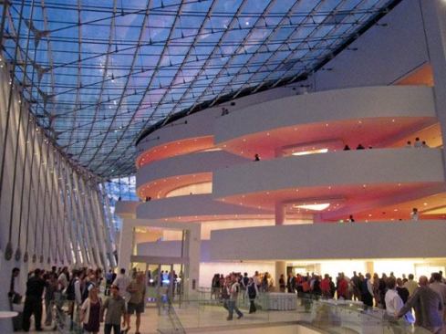 Brandmeyer Great Hall. A color wash is created by light reflected from the carpet (red for the Muriel Kauffman Theatre and blue for Helzberg Hall)­ a planned effect achieved through elaborate testing and mock-ups.