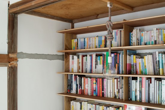2nd floor replaced the in-wall closet for a bookshelf