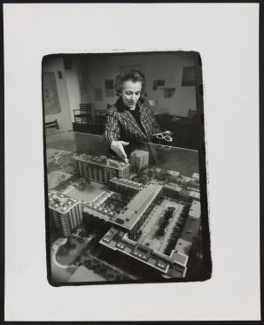 Architect Chloethiel Woodard Smith presents a model of her Capitol Park project for Southwest Washington, D.C. Photograph, circa 1960.