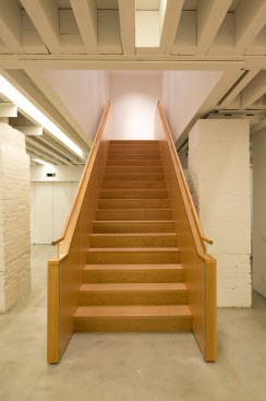 Base of gallery stairs.