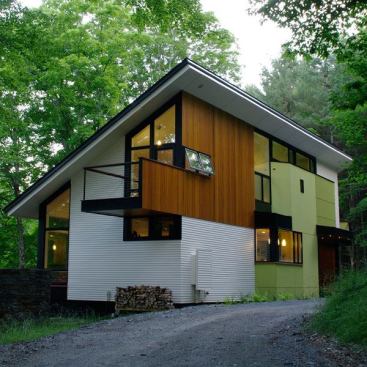 Architect: Jeff Stetter, Gossens Bachman Architects, Montpelier, VT &nbsp; Diverse materials and design elements are arranged to create an open, informal, comfortable wooded retreat. The assortment of windows facing every direction captures light and mountain forest views.