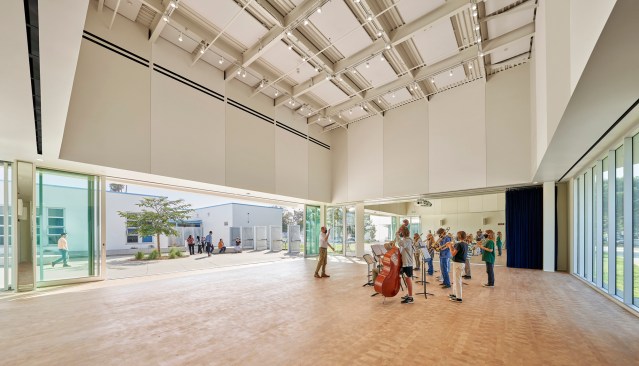 John Adams Middle School Performing Arts Center features various rehearsal spaces, including outdoor courtyards.