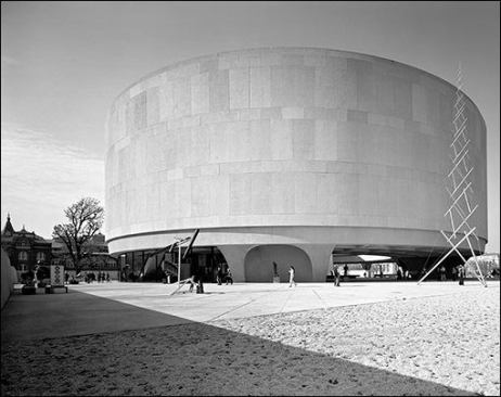 The southeast face of the Hirshhorn Museum, seen from inside the walls of the sculpture garden
