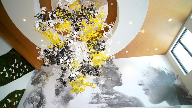 Yellow Goat Design build a custom Oh Oh light fixture for the lobby space of AMLI Midtown Miami. 