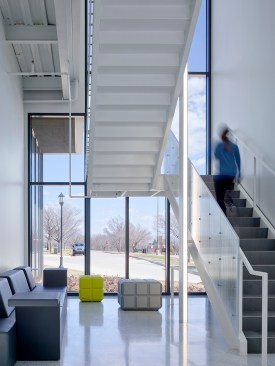 An interior atrium slices through the building 36’ high and skylights fill the space with ever-changing reflective energy.