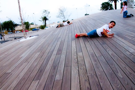 Children playing upon the undulating surface.
