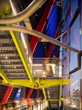 The facade creates a stage for visitors to move through exhibits and engage with pedestrians.