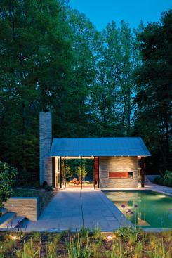 A new swimming pool, stone walls, and terrace behind the existing house organize the rear yard and connect the house and pavilion.