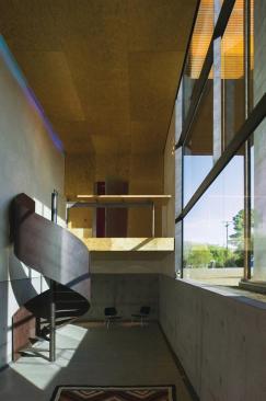 A sumptuously curving stairway serves as the studios grand flourish.