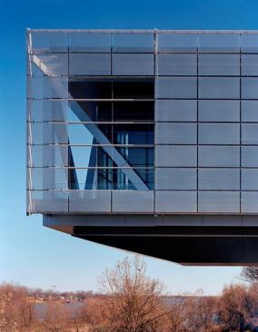 The structure of the Clinton Library cantilevers over the Arkansas River.