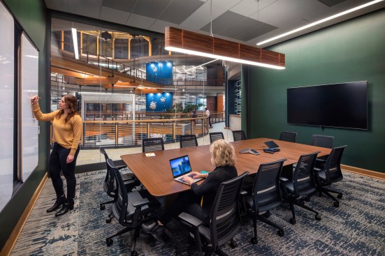 Destination collaboration "island" between lab blocks within the atrium