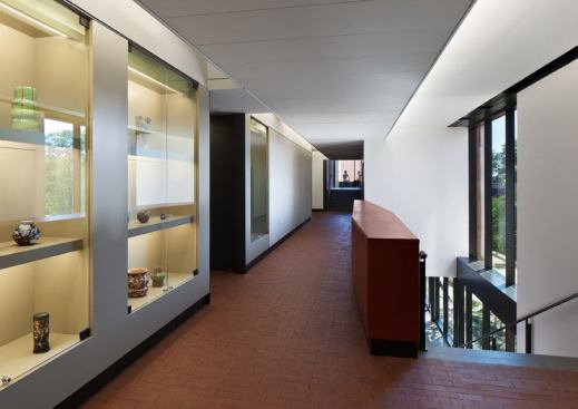  In the Arts Center corridors, outward-facing  asymmetric covelights, angled according to the ceiling, illuminate lobby areas  and radiate toward the plaza.
