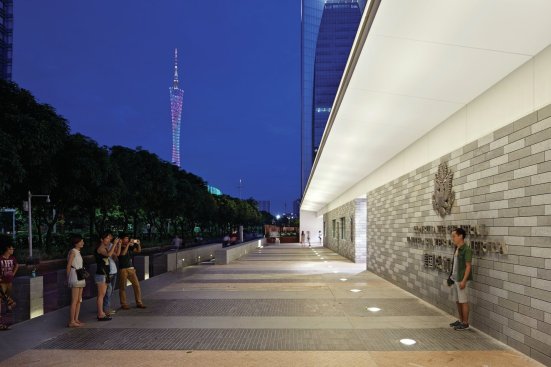 Pathways are lined in a locally quarried stone that also clads the body of the consulate.