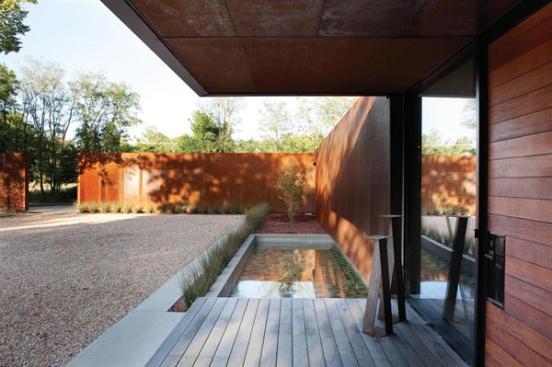 View across the entry pool to the garage, which helps define the auto court.