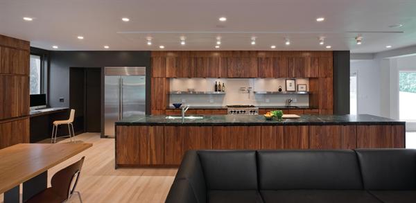 An open-plan kitchen with a large island anchors the main level of the home. 