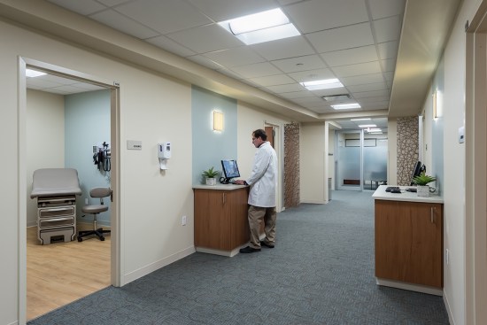 Centrally located clinical “touchdown” areas, to input and receive electronic information regarding patient care.