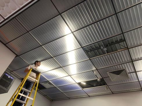 Visual excitement was generated in the elementary school by arranging the new LED fixtures in zigzags above frosted ceiling panels. Installation of the lightweight thermoformed panels was performed by staff. 