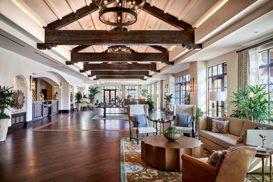 The main lobby features exposed heavy timber trusses reminiscent of the California Mission style.
