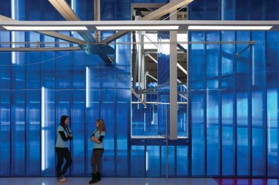 Party room interior with blue Polygal wall.