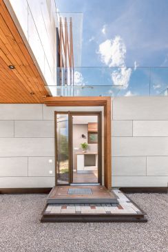 The finished house being placed on two trucks for transport