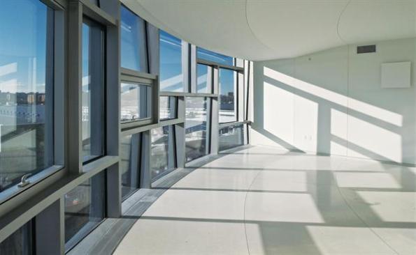The tilting windows of 100 11th Avenue form an intricate matrix that frames views from inside.