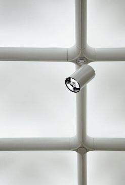 In the main gallery, a close-up view of the  modified coffer intersection with track accent lighting component.