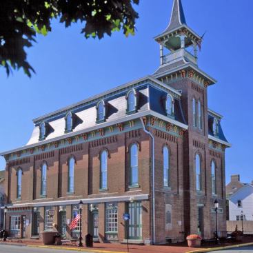 Architect: Jay Cooperson, Cooperson Associates, Wilmington, DE &nbsp; Marvin fabricated Clad Custom Ultimate Double Hung Round Tops to replicate the original windows. The re-creation of the third floor and its windows was based on a few old photographs.