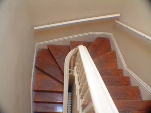 Before: The home's original staircase was located just off the living room.   2011 Remodeling Design Awards (September)  Whole-House Remodeling $250,000 – $500,000  Kube Architecture, Washington, D.C.