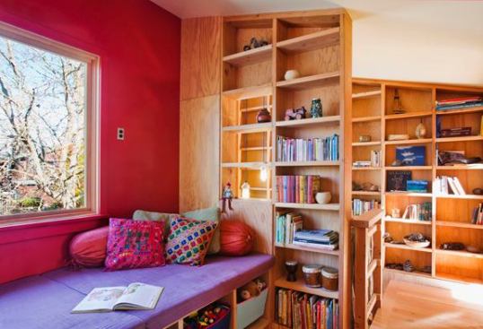 In this compact plan, each space serves several functions.  The exposed framing in the stairwell does double duty as bookcases.