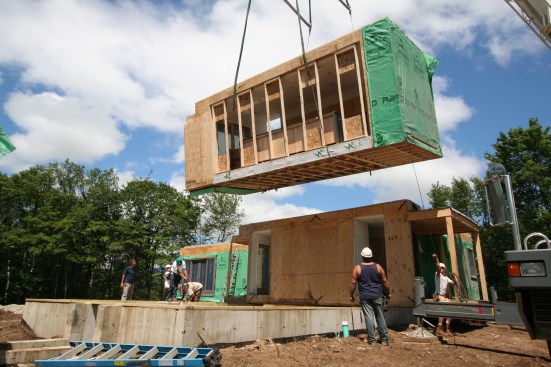 Prefab modules being set by crane