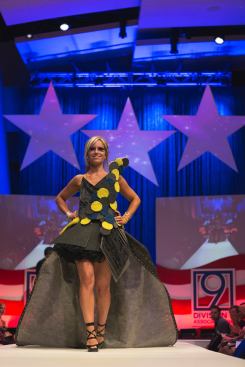 Designer Kristee Buchanan of Falls Church, Va.–based Eighth Day Design models the firm's Grover Cleveland–inspired dress made from carpeting materials.