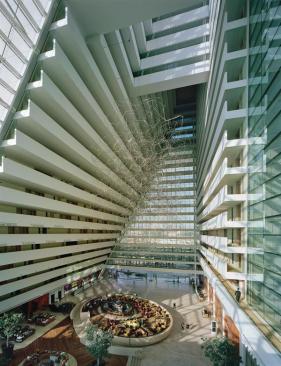 Nine million square feet of enclosed space allows for plenty of unique interior environments. The hotel tower atrium extends up to the 23rd floor, where the building narrows. The ground floor features lobby amenities and restaurants. Guest room circulation is accommodated by projecting balconies that look out over custom art installations.