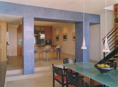 Colored plaster brightens the kitchen and dining room.
