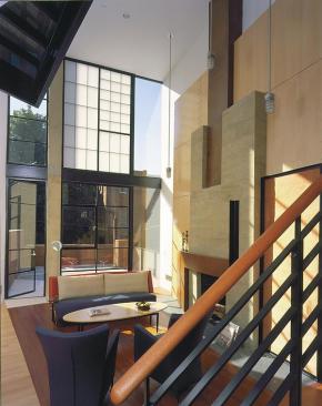 Upstairs, steel panels with copper wire cloth slideon rolling library hardware.