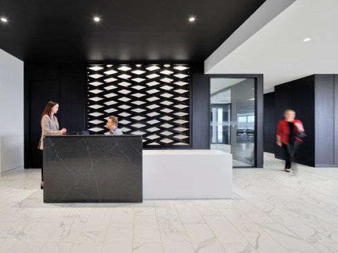 Reception area with custom designed and fabricated accent wall.