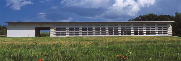 A custom-made sink against a wall of windows looks out onto the windswept prairie.