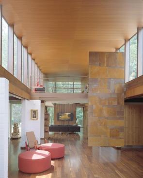 The 14 foot floating wall that defines the entryway also reminds the owner of some of his favorite songs. A music professor friend transformed musical notes into a grid pattern that is realized in the walls steel sections.