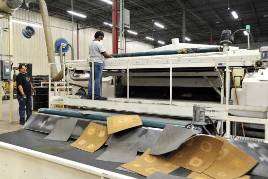 A machine separates the tile’s fiber from its backing, which is conveyed into a grinder and broken down into its base components of fiberglass, latex, and vinyl.