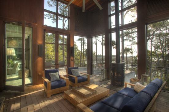 A screened-in porch underneath the view tower receives cross-ventilation no matter which way the wind is blowing.