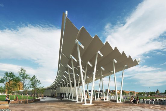 A pavilion with a pleated roof structure marks the ferry landing point on the site.