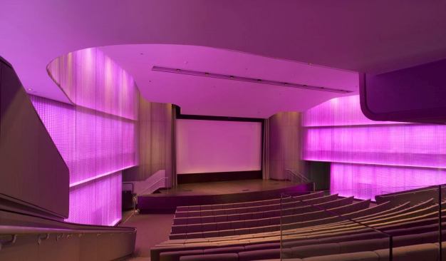 Color-changing LEDs covelights graze the walls, while general lighting is provided by PAR38 tungsten halogen downlights mounted within architectural slots fitted onto 'raise/lower' battens for ease of re-lamping. 