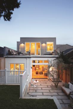 Both the ground-floor kitchen and great room and the second-floor master suite open up to the expanded backyard via folding French doors from Sierra Pacific Windows & Doors, featuring dual-pane, argon-insulated wood windows.
