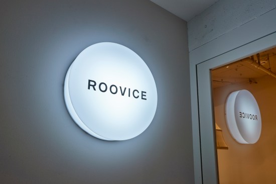 Lamp with the office logo at the entrance