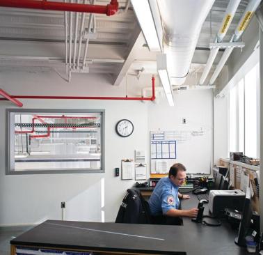 The second-floor Lieutenant?s office serves as a command center and allows (via an internal window) for oversight of the vehicle bay on the ground floor.