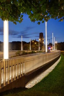 Planters are integrated into the hardscape and delineate the pedestrian path and enhance the overall pedestrian experience.