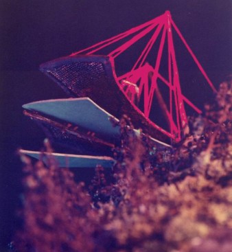 The seemingly laser-suspended structure embodies paradox, as tehy steel cables disappear in the dark of night