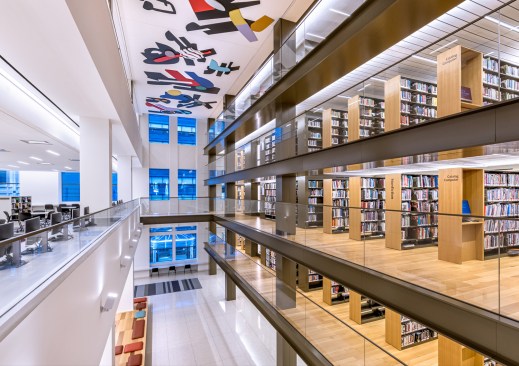 Book stacks are a vertical means of storing books dating back to the nineteenth century, and here they are revived to give open access for library users.
